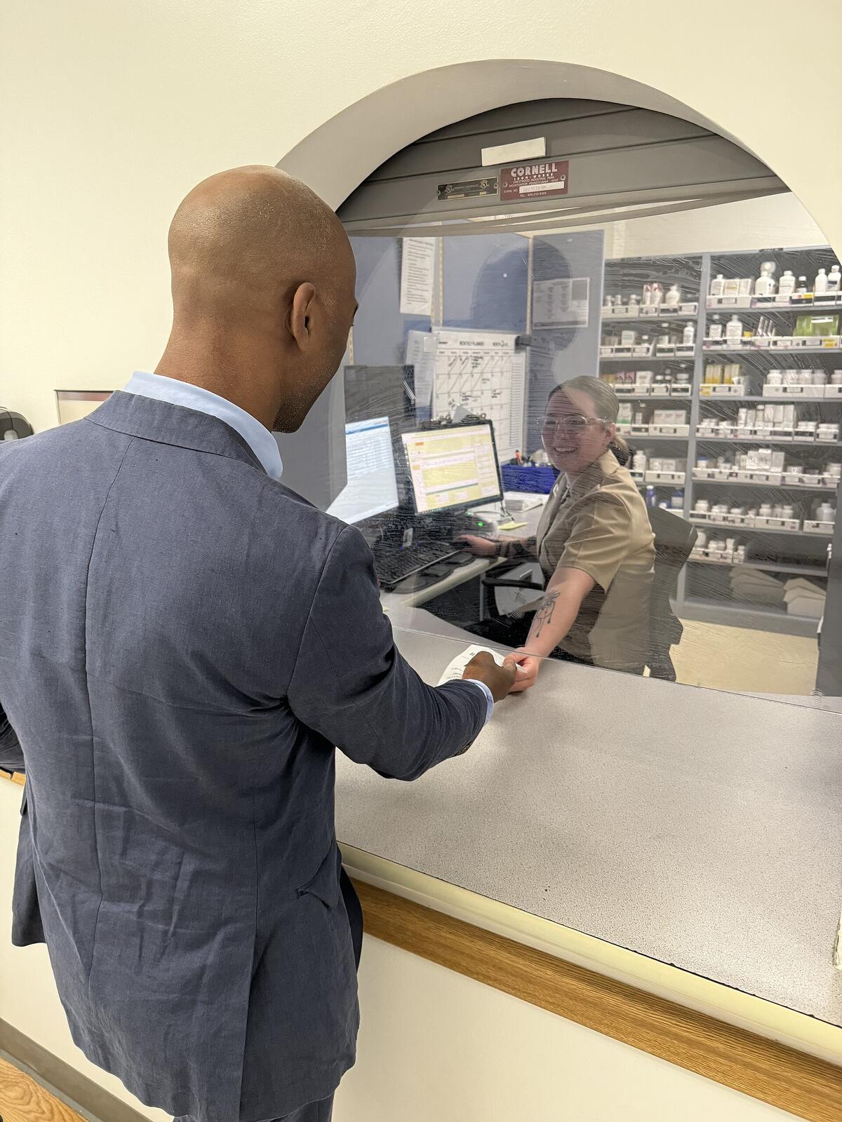 Health professional administering a vaccine to a patient
